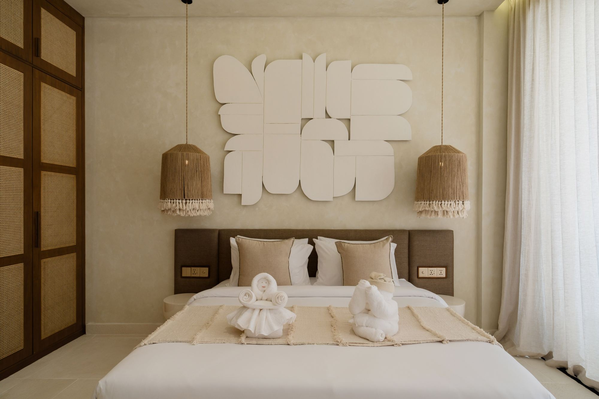 Bedroom with sculptural wall art
