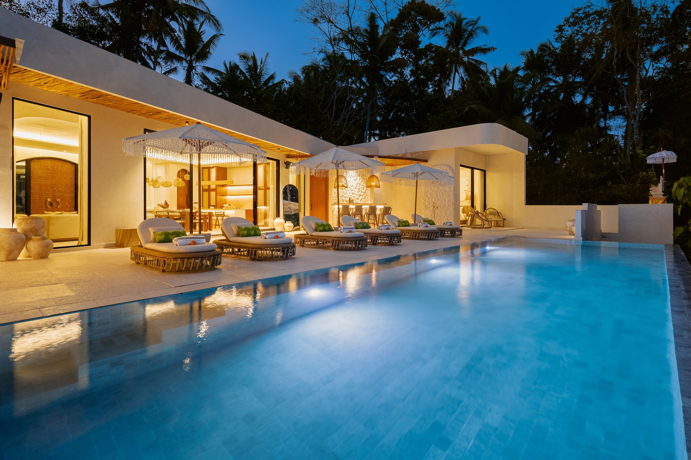Infinity pool lit up at dusk